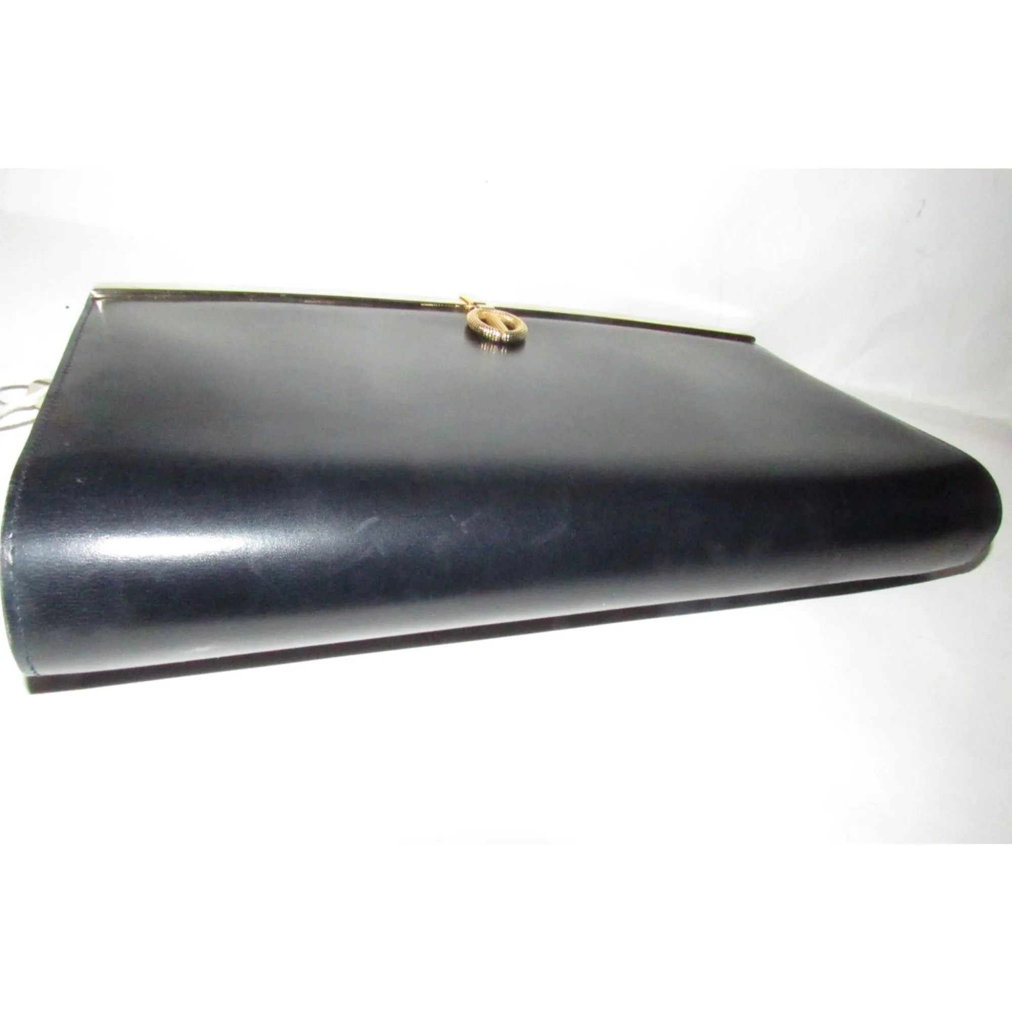 1960s mod, Dior, navy blue leather, two-way style with a hinged top with a latch snap closure, bold, gold Dior accents, & a removable strap
