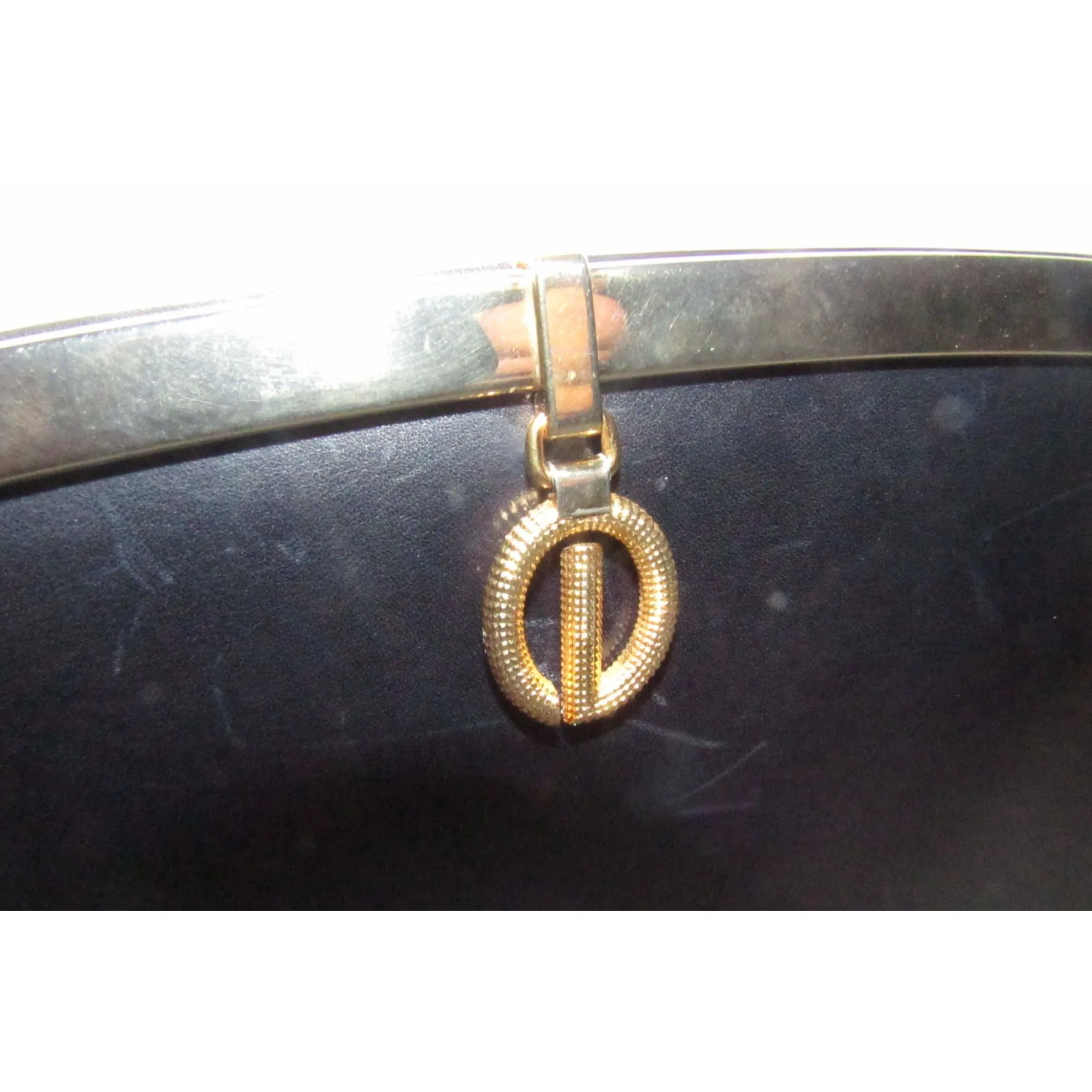 1960s mod, Dior, navy blue leather, two-way style with a hinged top with a latch snap closure, bold, gold Dior accents, & a removable strap