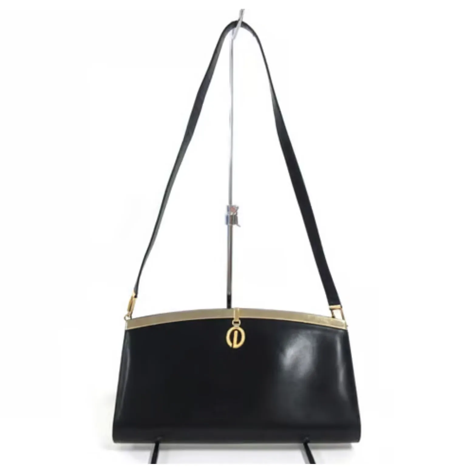 1960s mod, Dior, navy blue leather, two-way style with a hinged top with a latch snap closure, bold, gold Dior accents, & a removable strap