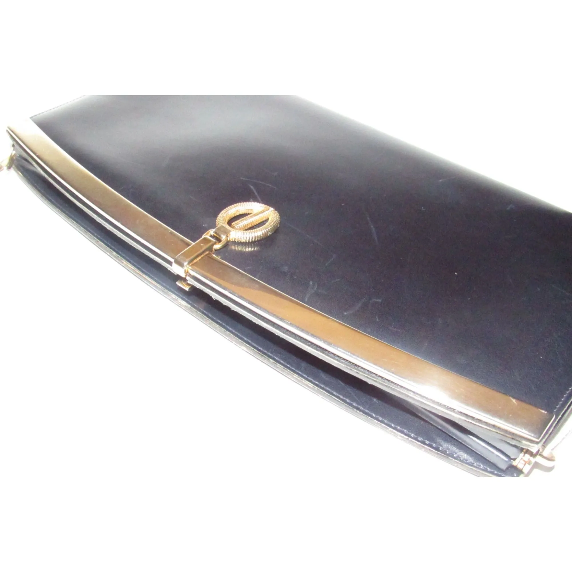 1960s mod, Dior, navy blue leather, two-way style with a hinged top with a latch snap closure, bold, gold Dior accents, & a removable strap