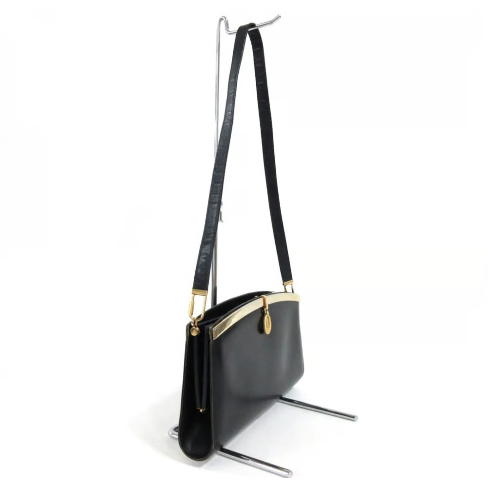 1960s mod, Dior, navy blue leather, two-way style with a hinged top with a latch snap closure, bold, gold Dior accents, & a removable strap